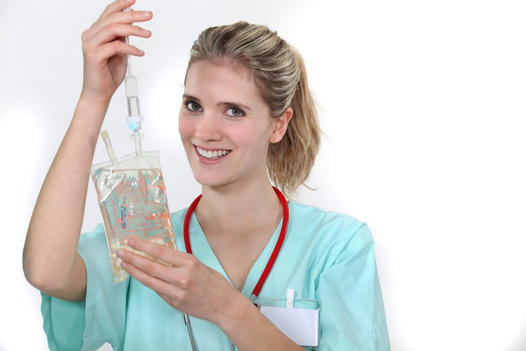 a nurse holding a dextrose bag